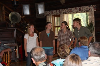 Justin, Amanda, Melanie and Sofia Von Trapp singing in the Main Lodge During Dinner